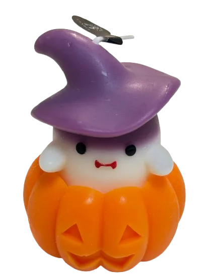Little Witch candle: an ivory ghost wearing a plum witch hat, peeping out of an orange jack-o'-lantern
